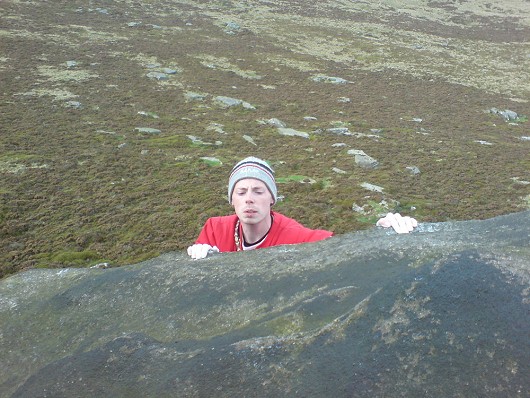 Trying to find holds at the top of Great Buttress Dovestones  © SGD