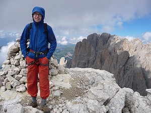 On top of the Innerkoflerturm after climbing Via del Calice. Langkofel in the background.  © Harald