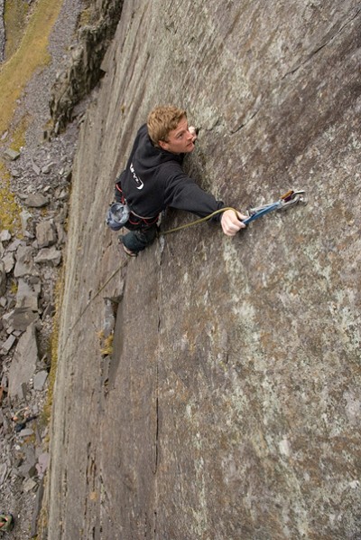 Adam Hocking clipping the new bolts of The Gorbals E4 6a  © Mark Reeves