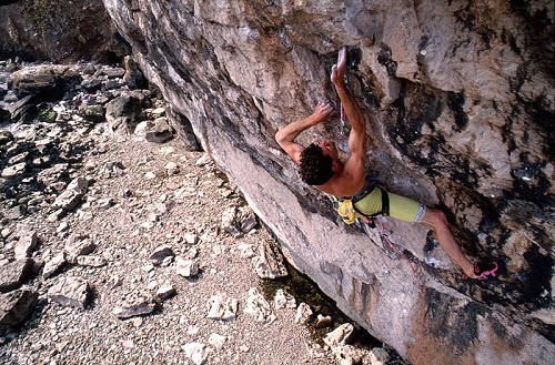 Jerry climbing his route Liquid Ambar (F8c/+)at Lower Pen Trwyn in 1990. The route (correctly spelt 'Liquid Ambar') is named in memory of Jerry's younger brother Toby who died in 1987. © Kurt Albert. 
  © Vertebrate Publishing/Jerry Moffatt
