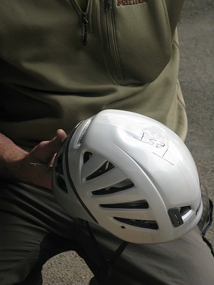 The lightweight foam helmet (a Petzl METEOR III) as you can see absorbed the energy from the rock and deformed.  © Mick Ryan - UKClimbing.com