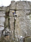 Me climbing Broken Crack, Froggatt Edge, with Dave C belaying