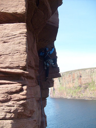 Entering the first roof on the crux pitch, Old Man of Hoy  © Charlie Boscoe