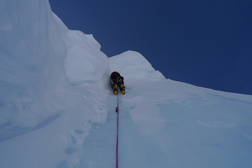 Climbing bullet-hard serac ice at the top of the face on Night of the Raging Goose.  © Gavin Pike
