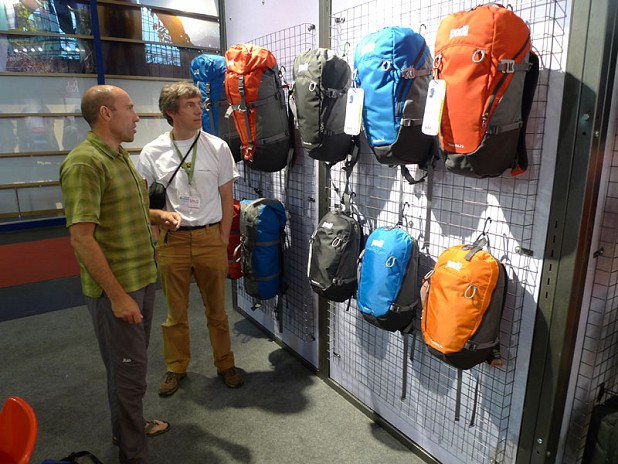 Neil McAdie of Equip Outdoor shows off the new PODsacs range to Alan James at the Friedrichshafen Outdoor show 2009  © Mick Ryan - UKClimbing.com