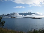 Morning mist advancing over Vagevøy, Lofoten, Norway