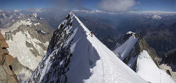 Stitch of Luke Hunt on the summit of the Grand Pillier D'angle- Peuterey Integral  © Jon Griffith
