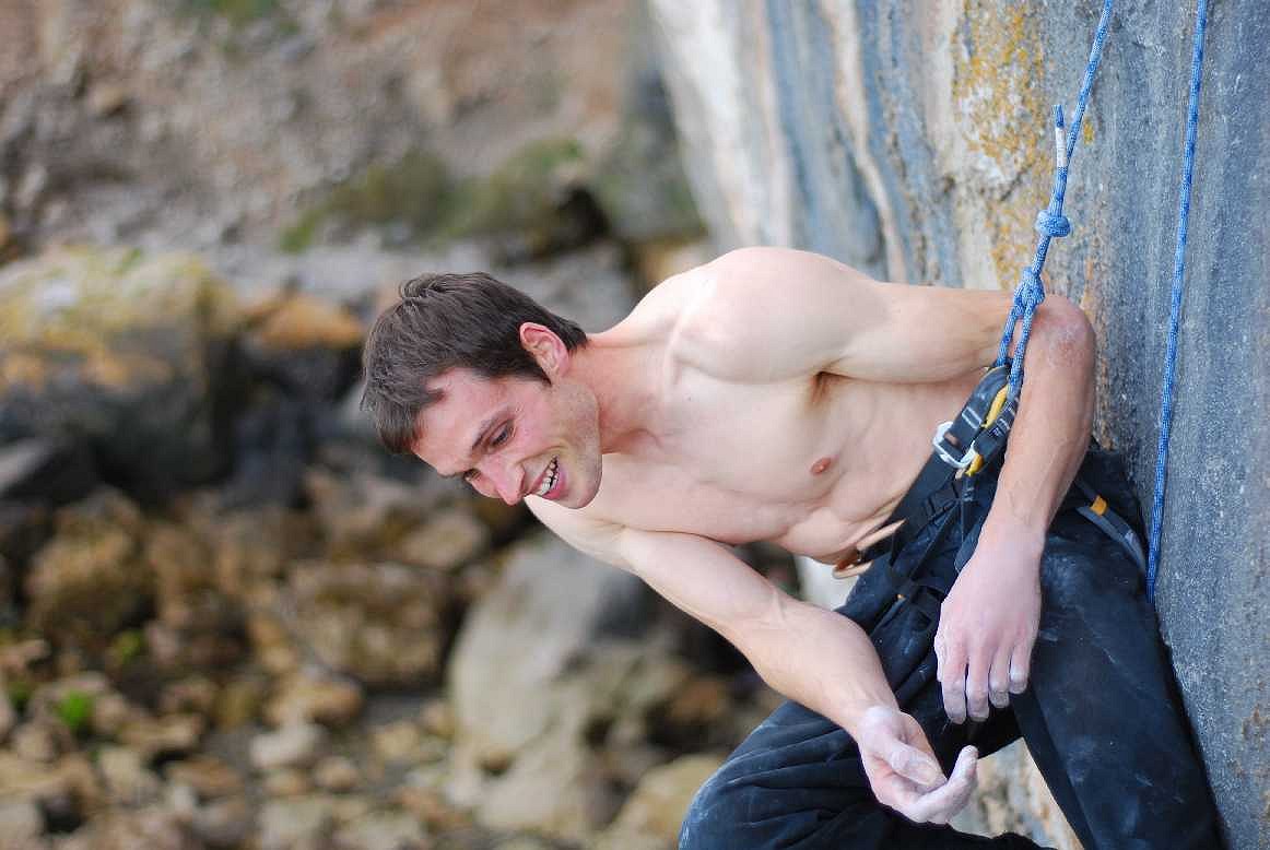 Pete Robins at the belay of Liquid Ambar, F8c after his successful redpoint ascent.  © Adam Wainwright