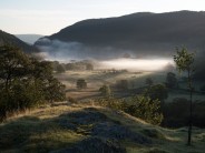 Llyn Crafnant, North Wales with morning mist burning away.