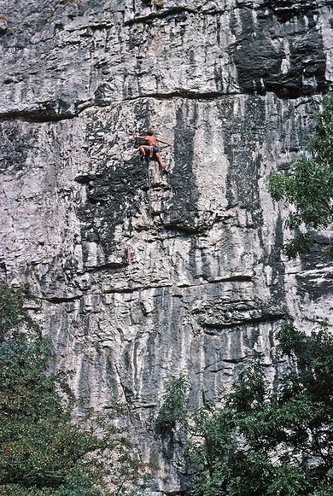 Ron Fawcett on first free ascent (one peg) of the old aid route Hubris at Raven Tor.  © Al Evans