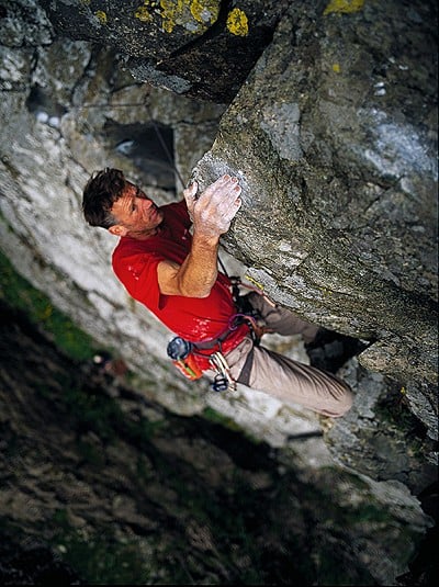 Dave Birkett on the upper section of Uphellya. Steep climbing on large loose blocks.  © Alastair Lee, Posing Productions