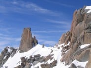 Climber on the crux slab, Cosmiques Arete