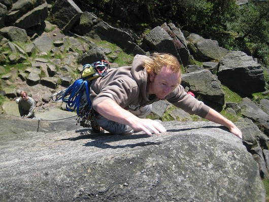 Phil, on the final unprotected move on 'Black Slab', Burbage North.  © purple sue
