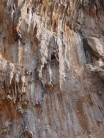 Tufa action on Monahiki Elia, 6a+, Grande Grotte