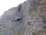 Wes Hunter stretching a youthful groin on one of the harder E4 routes around.Lost Horizons on the East Buttress.