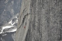 Two Canadian guides high on the Lotus Flower Tower approaching the 3ft roof crux pitch.
