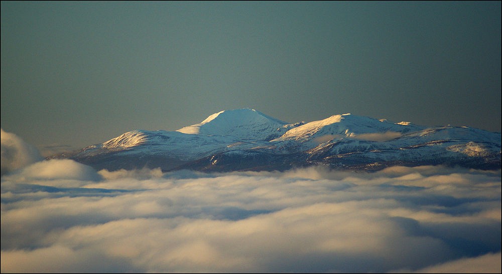The East face of Ben Lawers towers over rising clouds.  © WillDC