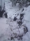 Dave Wilson seconding the Rotunda Gully (Mod, in the dry!) at Roaches Upper in heavy snow.