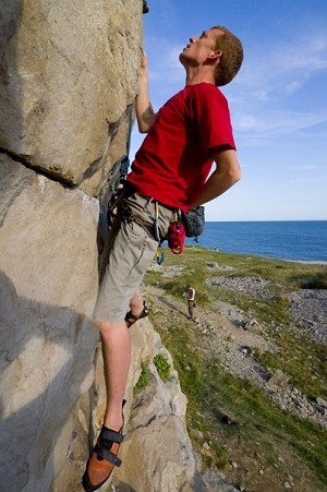 Fred climbing at Dancing Ledge near Swanage, Dorset  © solenostomus