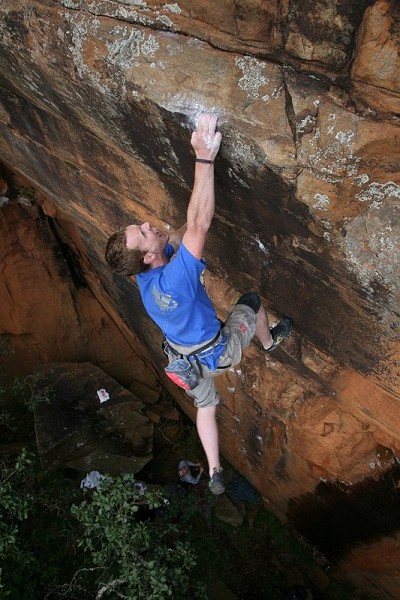 Climber cranking hard on Lab Rat 8b at Hallucinogen Wall, Waterval Boven, South Africa   © Gustav Janse van Rensburg
