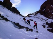 Cutting footholds on ascent near Toubkal