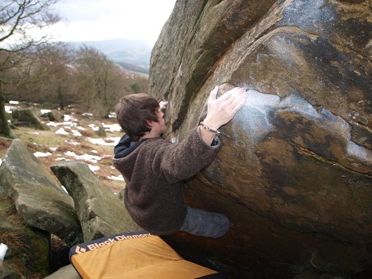 lewi climbing a boulder problem near sheffiled.  © john lynch