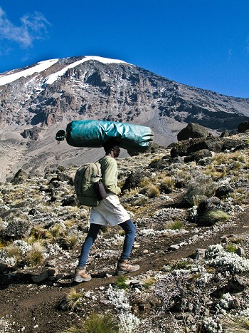 Porter on Kilimanjaro in Tanzania  © alex ekins