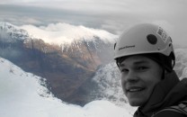 Me at the top of dorsal arête with a break in the cloud