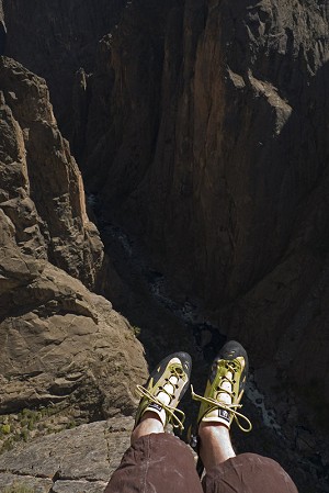The author wearing a fairly stiff pair of shoes slightly bigger than his normal size, on a long route in the Black Canyon, USA  © Jack Geldard