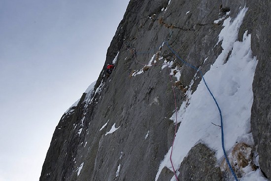 On the crux pitch of Bring Home the Bacon, VII 8. Second ascent, Rive Gauche of the Argentiere Glacier, France.  © William Sim