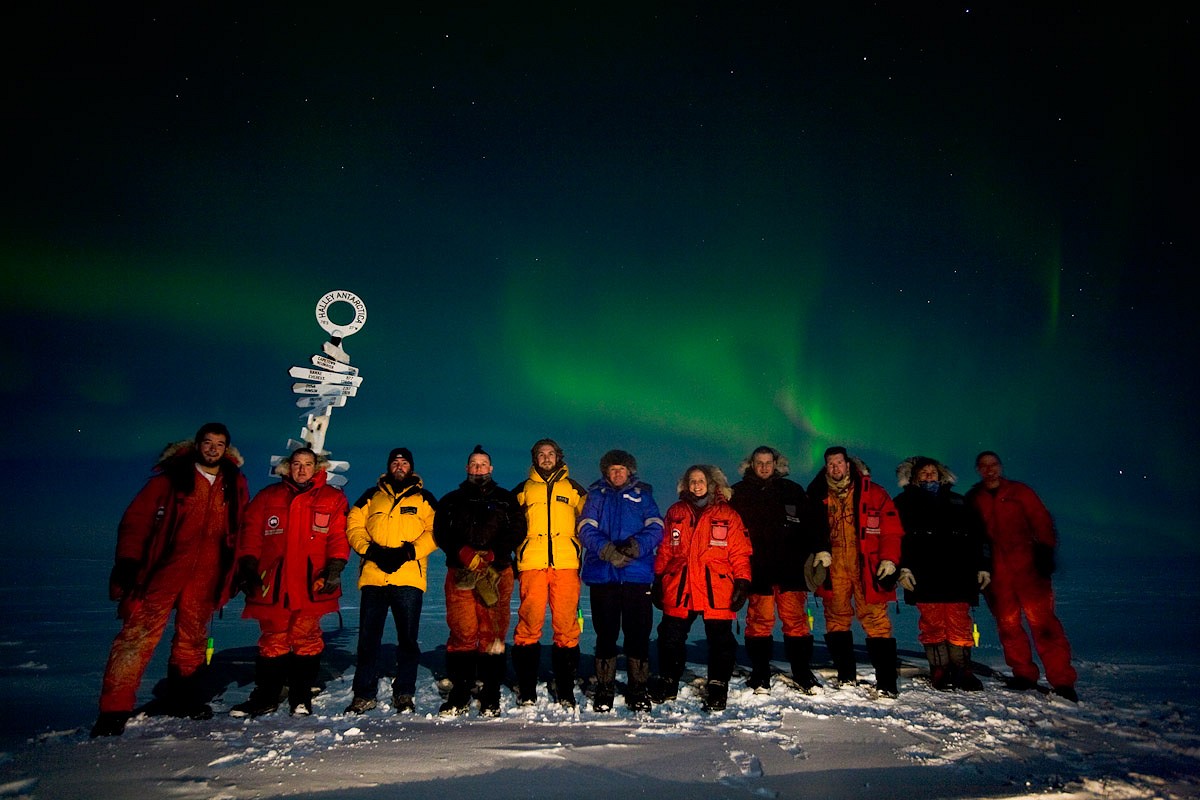 The Halley Winterers below a mid-winter aurora  © British Antarctic Survey