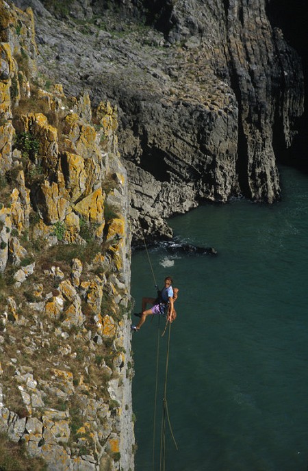 Abseiling with the ends of the rope in to Mother Carey's  Kitchen. Pembroke  © Mike Robertson