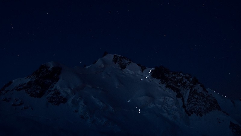 The power of light: headlamps on their way to the summit of Mont Blanc through the Col du Mont Maudit  © Alexandre Buisse