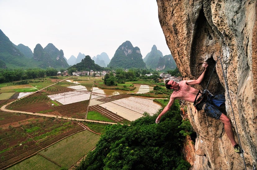 Hugh on the last moves of Todd Skinners nameless route, 7b, Banyan Tree, Yangshuo, China  © Milnes