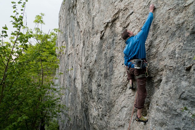 Jack Geldard climbing a classic 7a+ in the Stretchman Jacket at a windy Freyr, Belgium  © Alan James