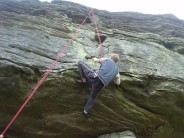 james proving he can do the route after being placed, via abseil, onto the lowest face hold.