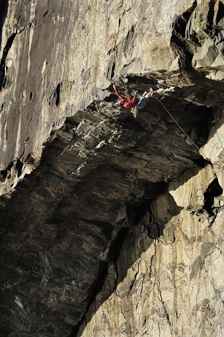 Steve McClure, at his limit, leading the main arch pitch high above a raging sea. Pabbay.  © Tim Glasby