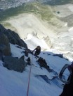 Climbing the ice pitches to the left of the rognon on the Frendo Spur. Lac Blue below and Chamonix even further down.