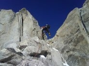 Racing up the easy rock near the top of the Kuffner Arete, Mont Maudit.
