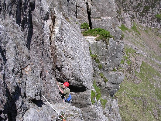 Gareth emerging from the chimney on pitch 2 of Main Wall  © andybenham