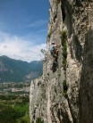 Me top roping the upper part of Supertramp.  Lake Garda in the background