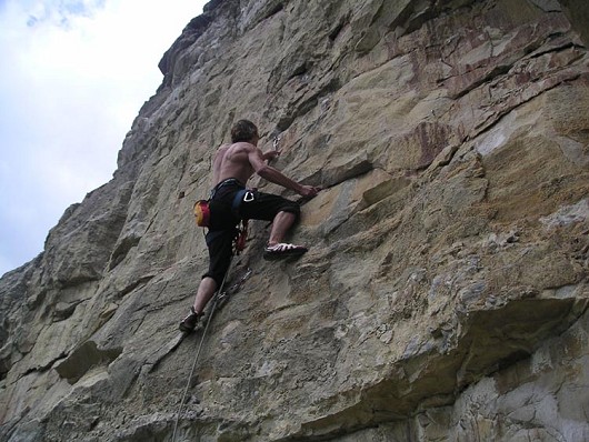 Simon Hann clipping in to second bolt, Ammonitemare, 6a+, Hedbury Quarry  © Rory McCrae