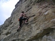 Simon Hann clipping in to second bolt, Ammonitemare, 6a+, Hedbury Quarry