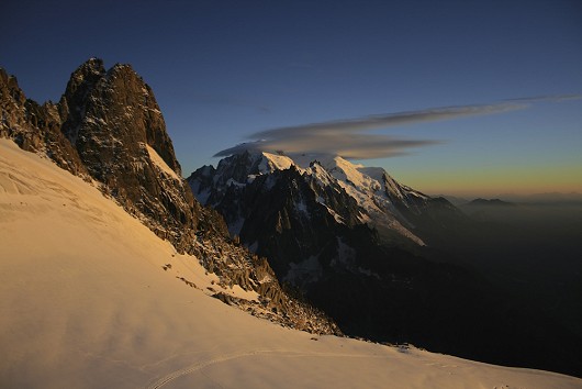Watching the sunset before climbing the Couturier Couloir of the Verte.  Mont Blanc range.  © ScottMackenzie