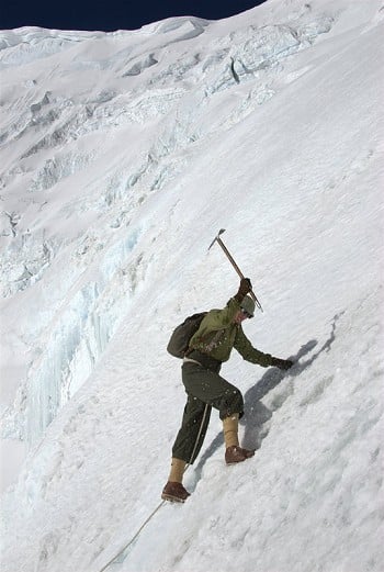 Conrad Anker, using replica 1920's clothing and equipment, cutting steps on the ice slope below Everest's North Col  © Altitude Films