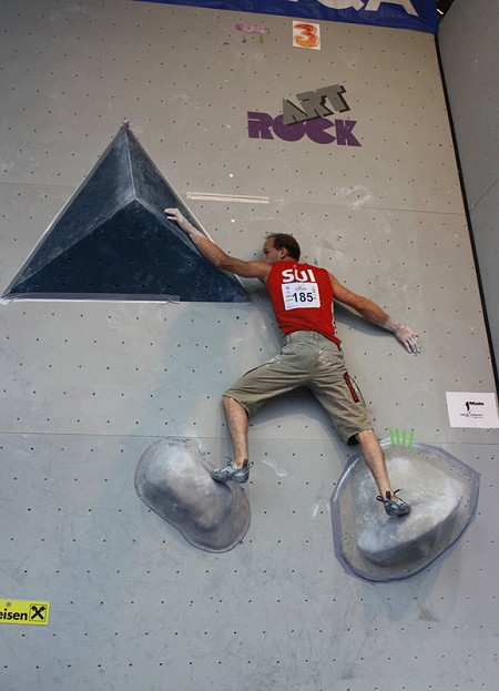 Cedric Lachat cranking to first place in the men's bouldering comp  © Sarah Burmester