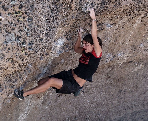 Sarah Schneider on an unrecorded problem (about V3) at The Alcove , the Sherwin Plateau.  © Mick Ryan