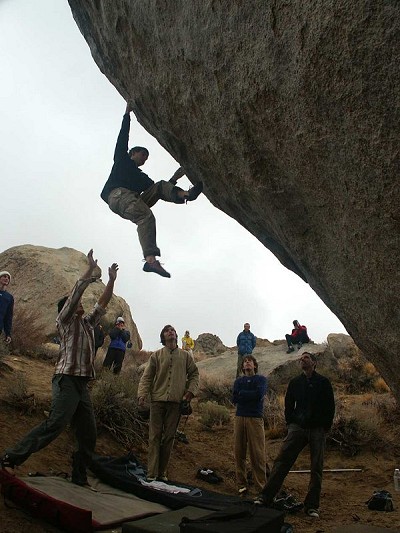 Tony Lamiche (front right) and Chris Sharma (front centre) watch boulderers attempting the Mandala V12  © Mick Ryan