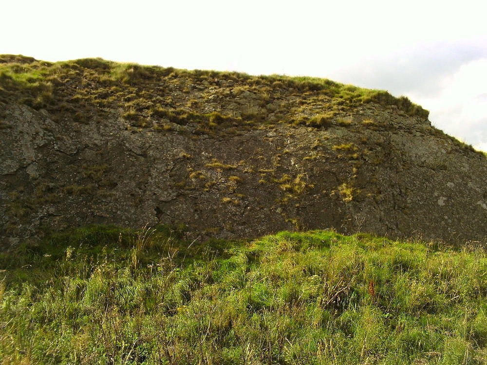 the rear of the hill showing the rock face area  © chriz