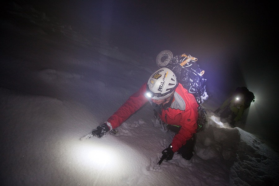 Tim Emmett retreating in a storm back to the Grands Montets  © Jon Griffith